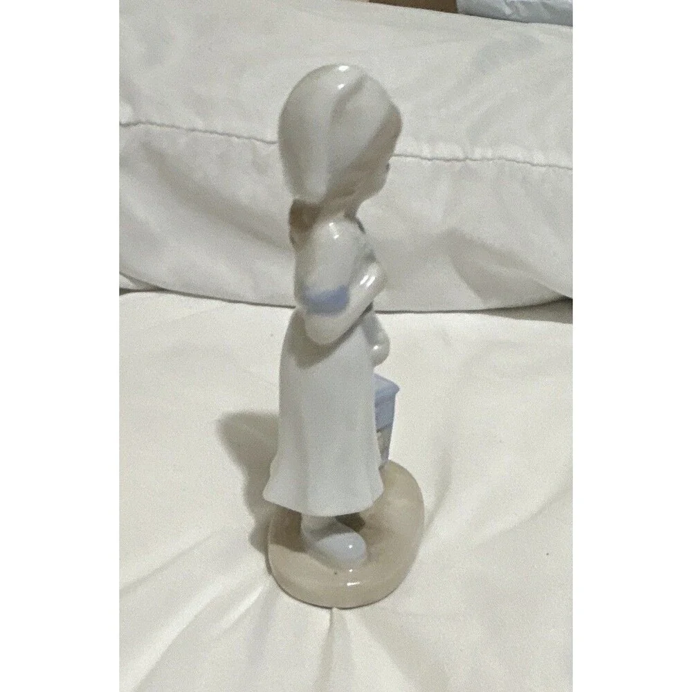The K Collection, Inc. vintage Glazed Porcelain Nurse Figurine White/Blue
